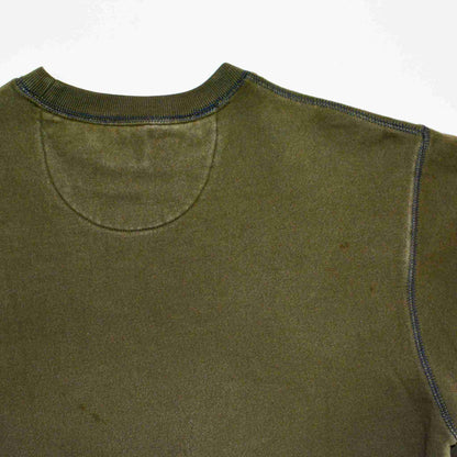 a close up of a green shirt with a white background.