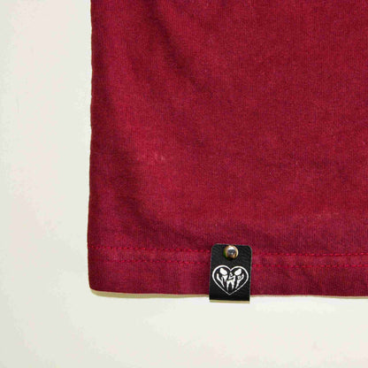 a close up of a red shirt with a heart on it.