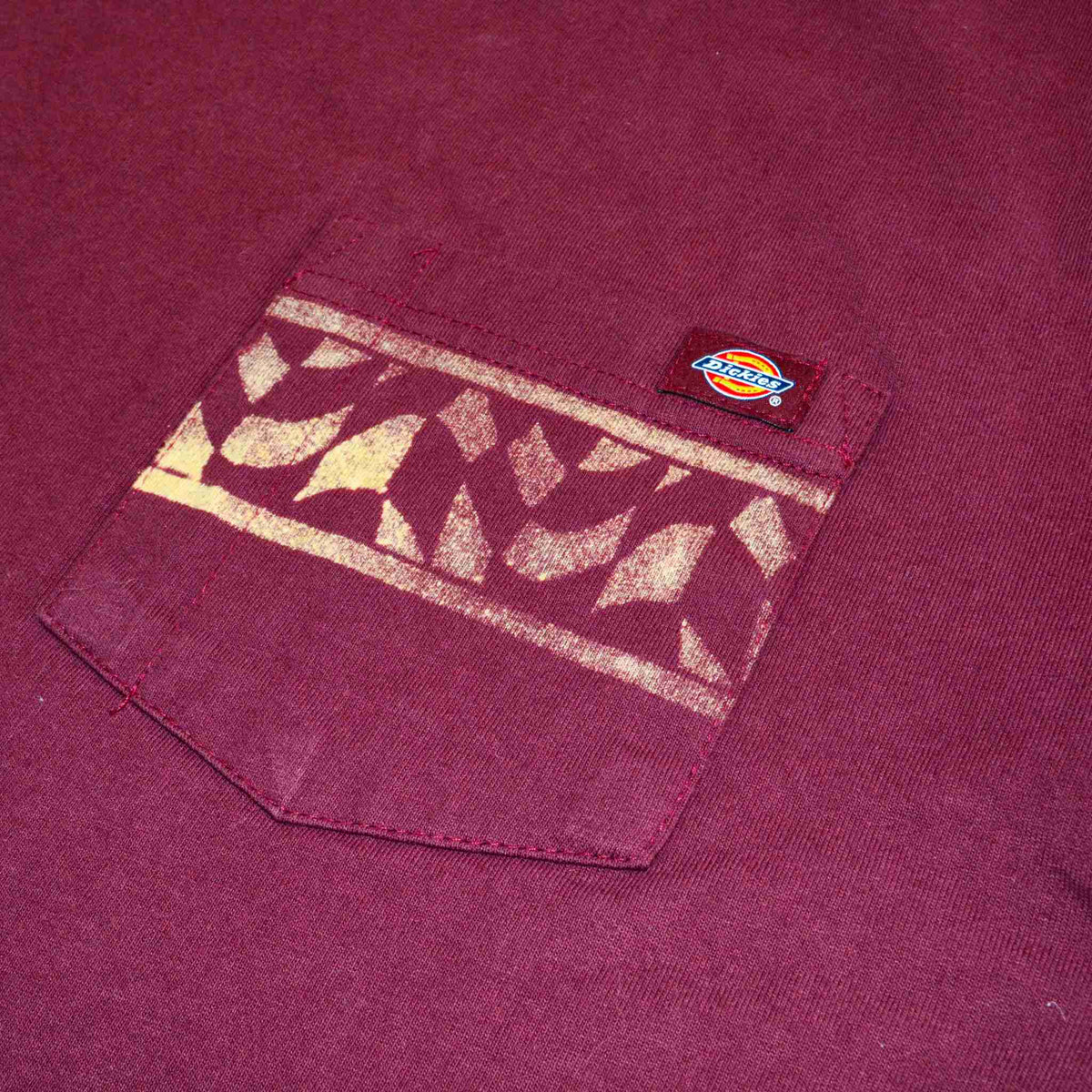a close up of a shirt with a patch on it.