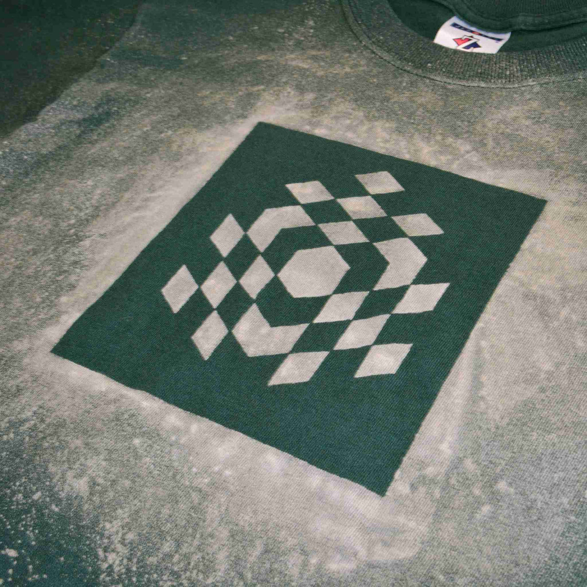 a skateboarder is doing a trick on the cement.