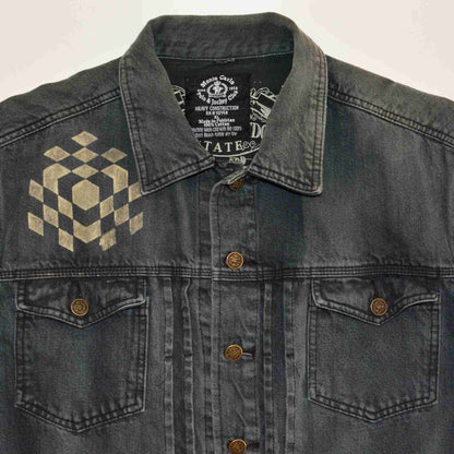 a black jean jacket with a checkered design on it.