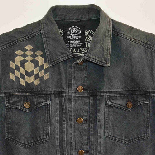 a black jean jacket with a checkered design on it.
