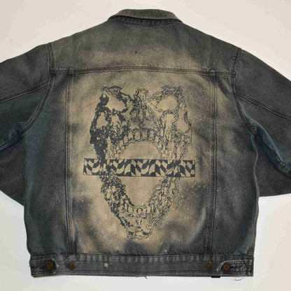 a denim jacket with a picture of a heart on it.