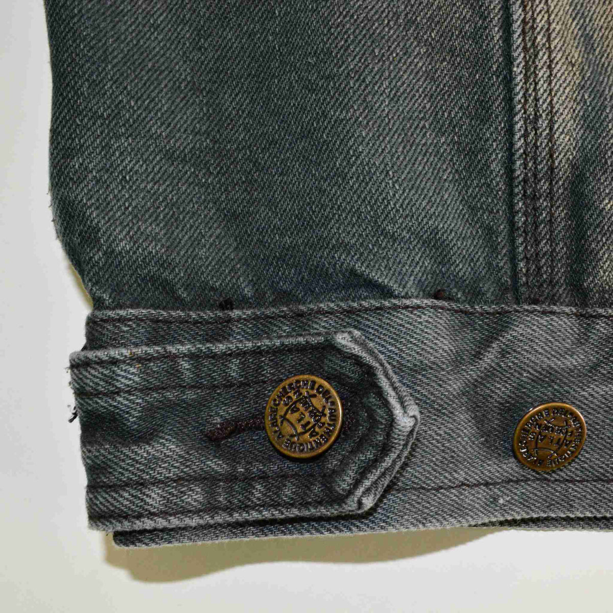 a close up of a pair of buttons on a pair of jeans.