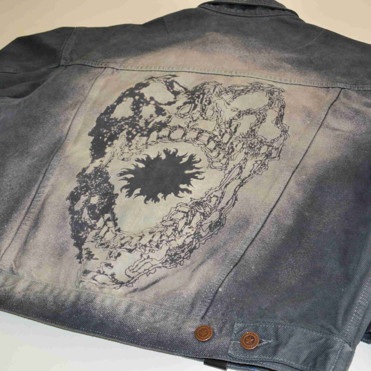 a jacket with a picture of a tree on it.