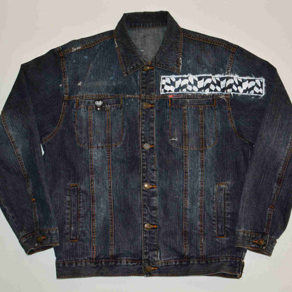 a denim jacket with a patch on the back of it.