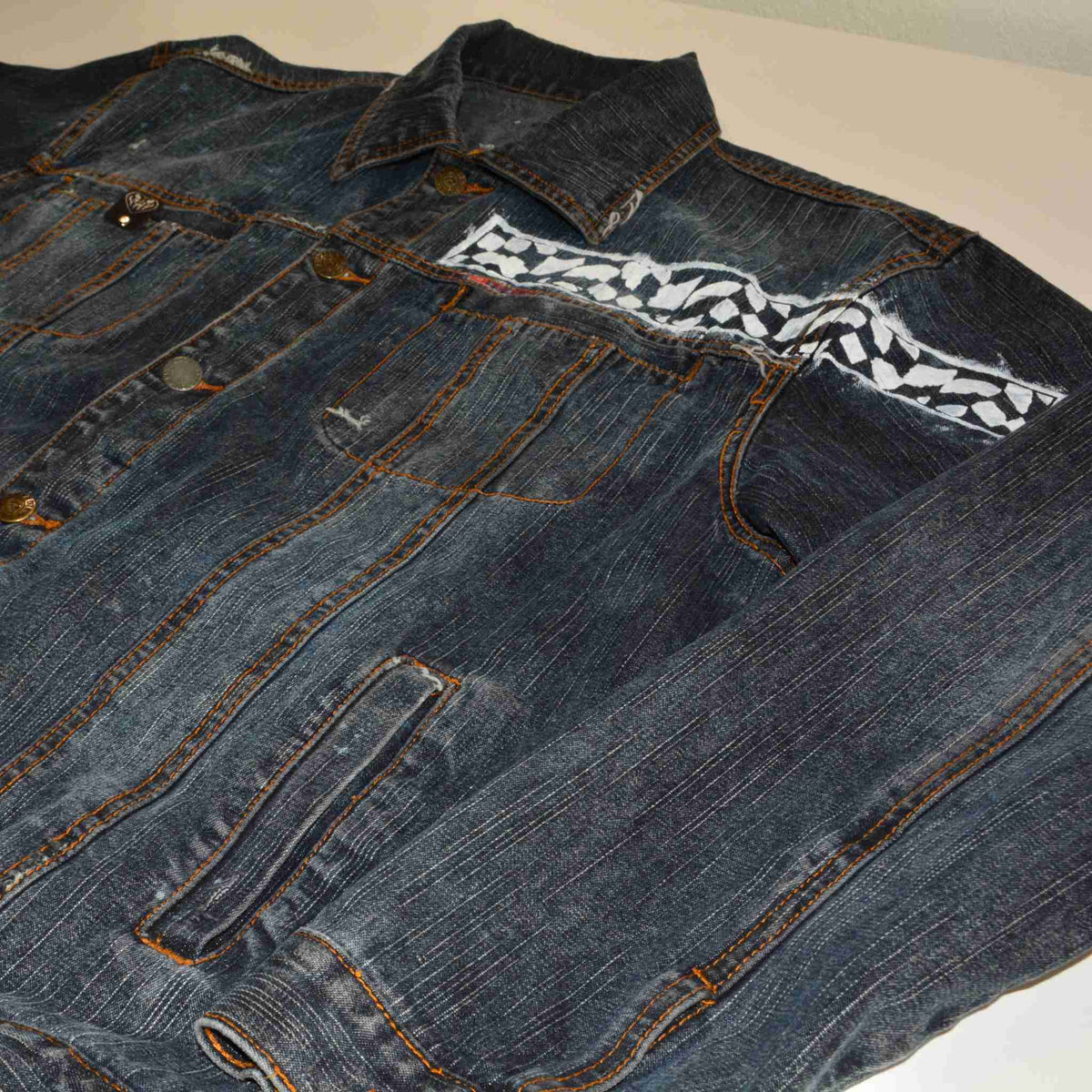 a pair of jeans with a tie on it.
