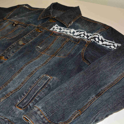 a pair of jeans with a tie on it.