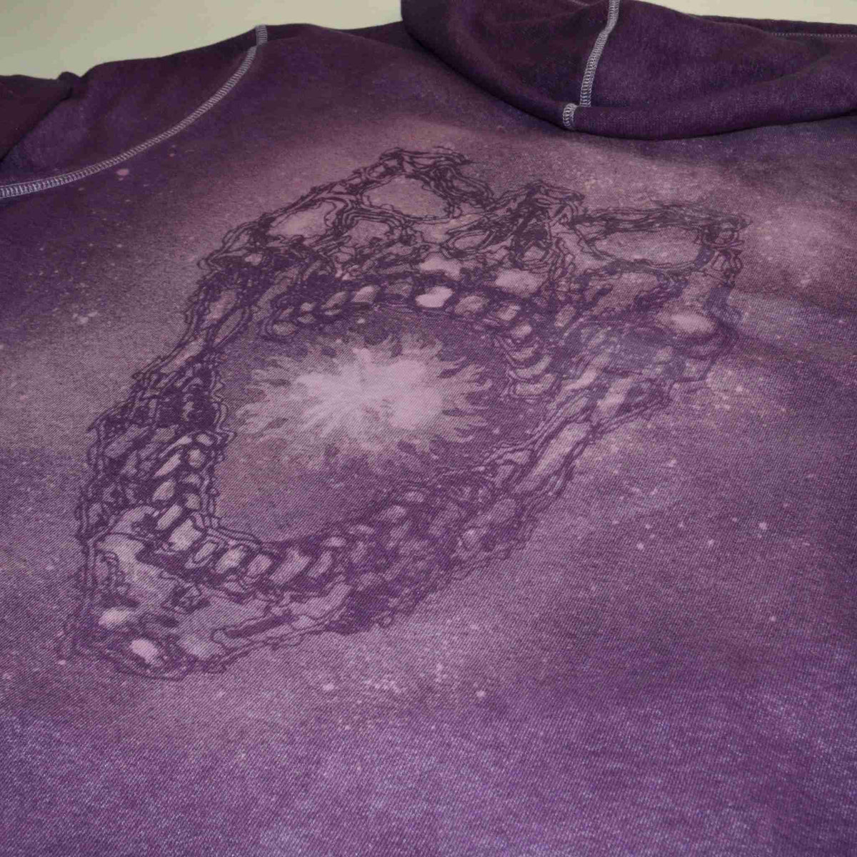 a t - shirt with a picture of a heart on it.