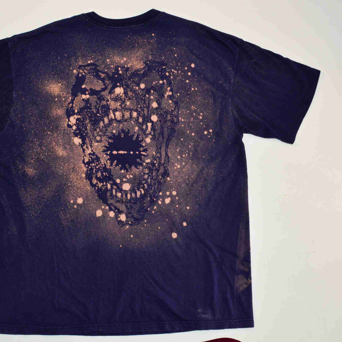 a t - shirt with a picture of a bear on it.