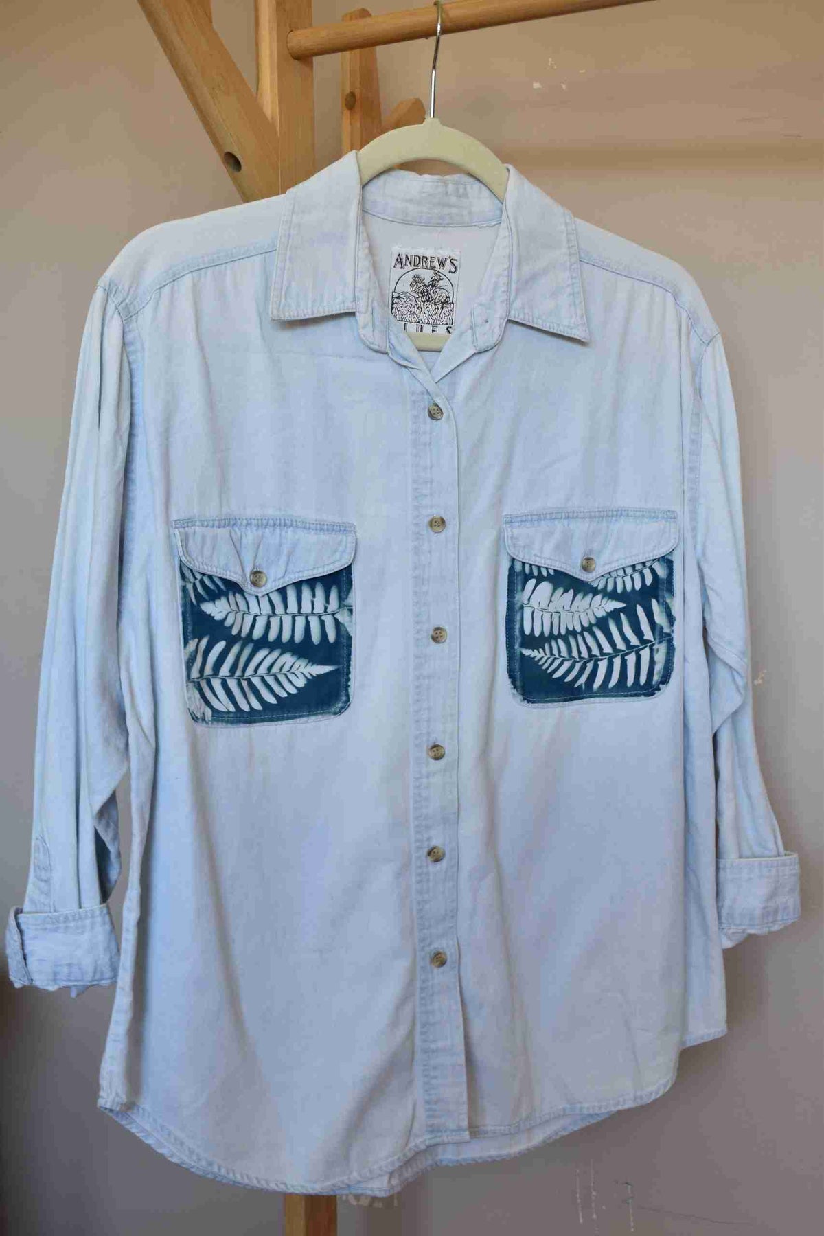 a white shirt with a blue design on it.