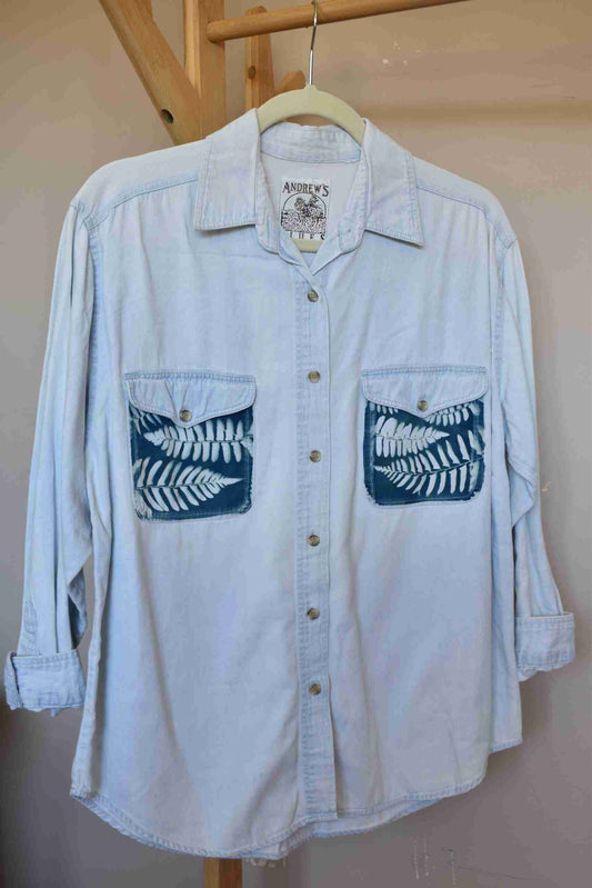 a white shirt with a blue design on it.