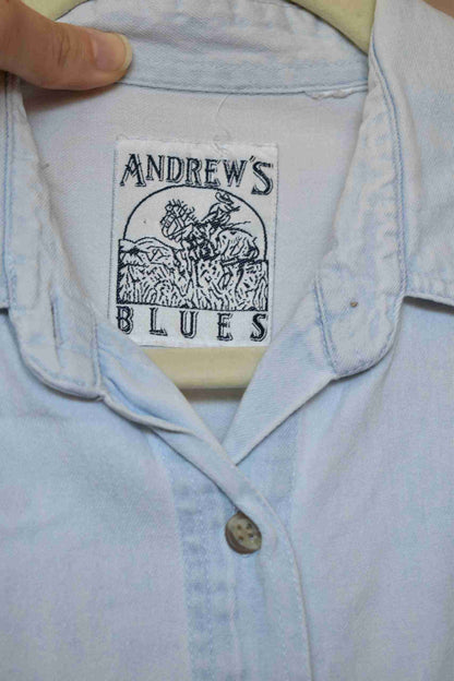 a button up shirt with a picture of a horse on it.