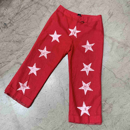 a pair of red pants with white stars on them.