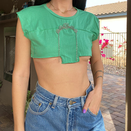 A woman wearing a 1of1 floral mint micro crop top and jeans.