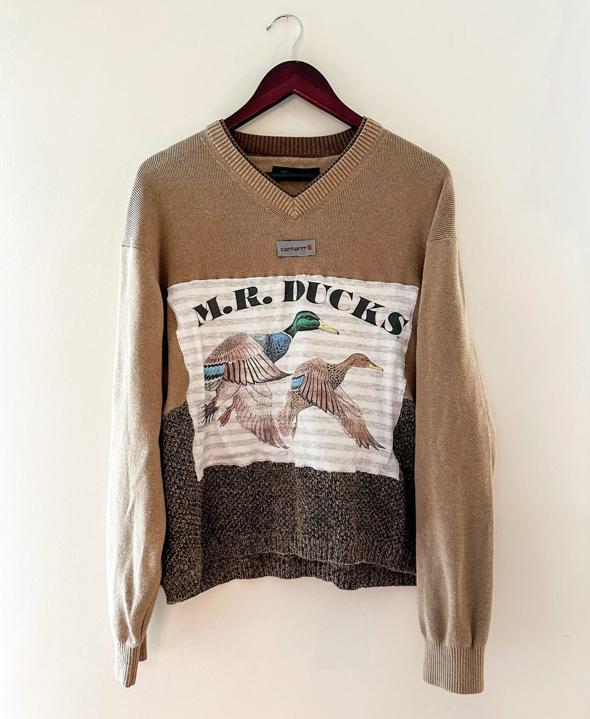 A sweater with the words mr ducks on it.