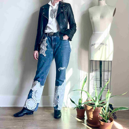 a woman standing in front of a mannequin.