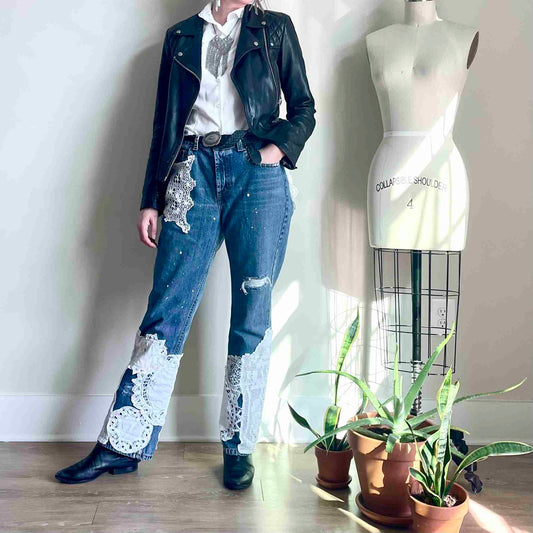 a woman standing in front of a mannequin.