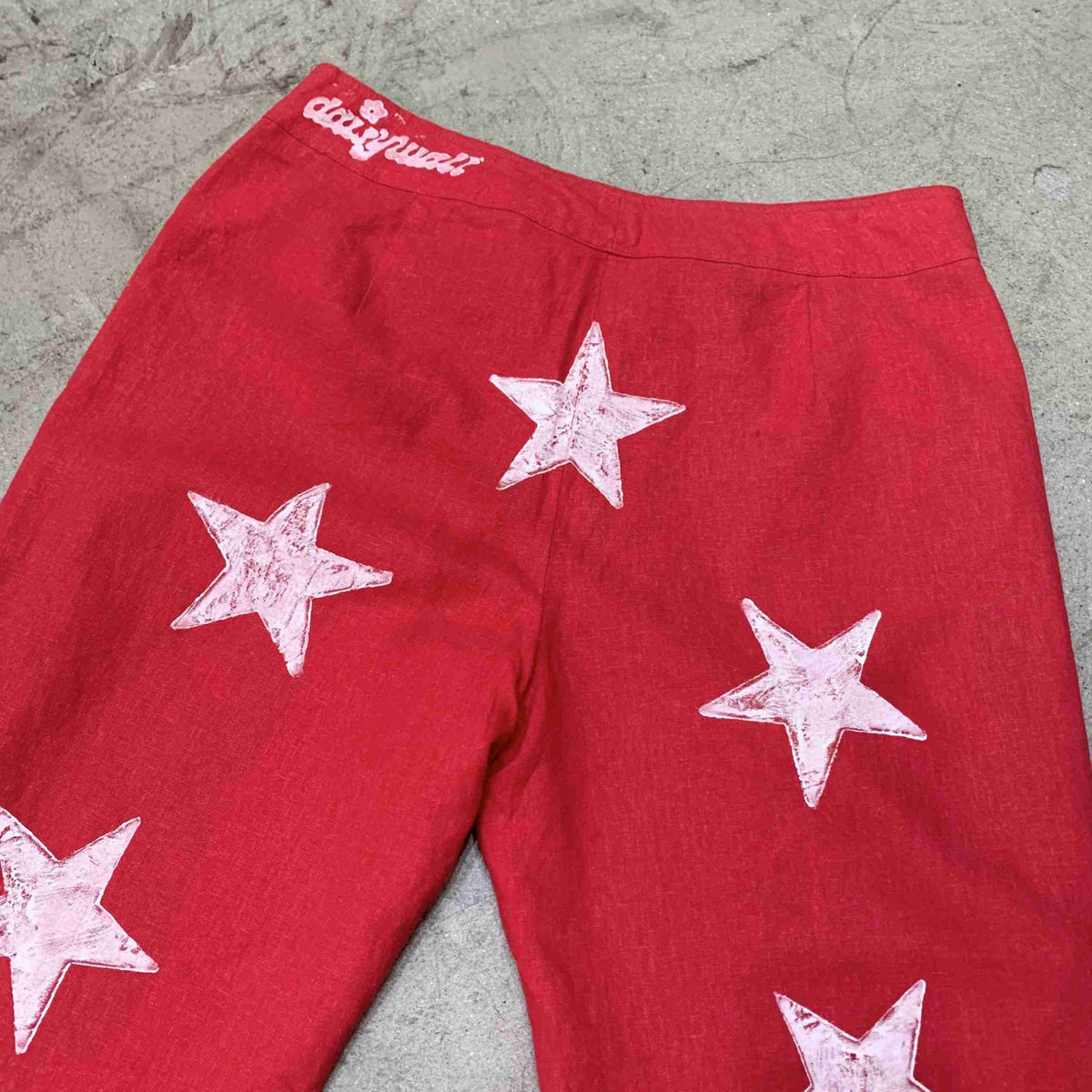 a pair of red shorts with white stars on them.