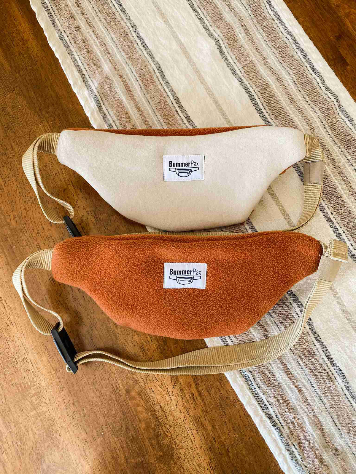 a pair of purses sitting on top of a table.
