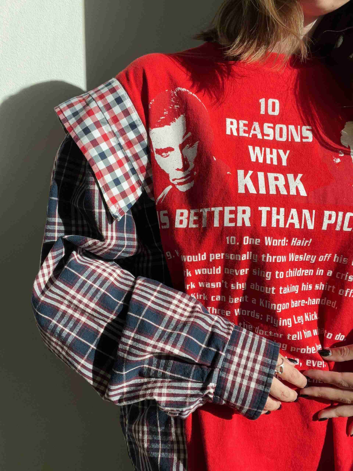 a woman wearing a red shirt and plaid pants.