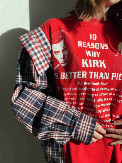 a woman wearing a red shirt and plaid pants.