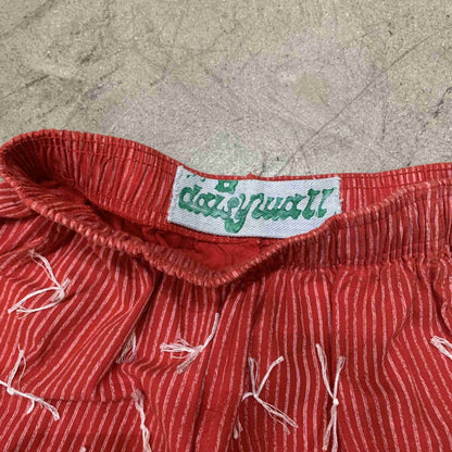 a close up of a red and white stripped shirt.