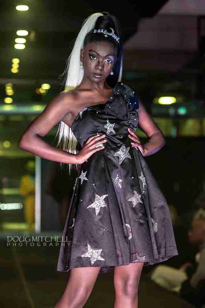 a woman in a dress with stars on it.