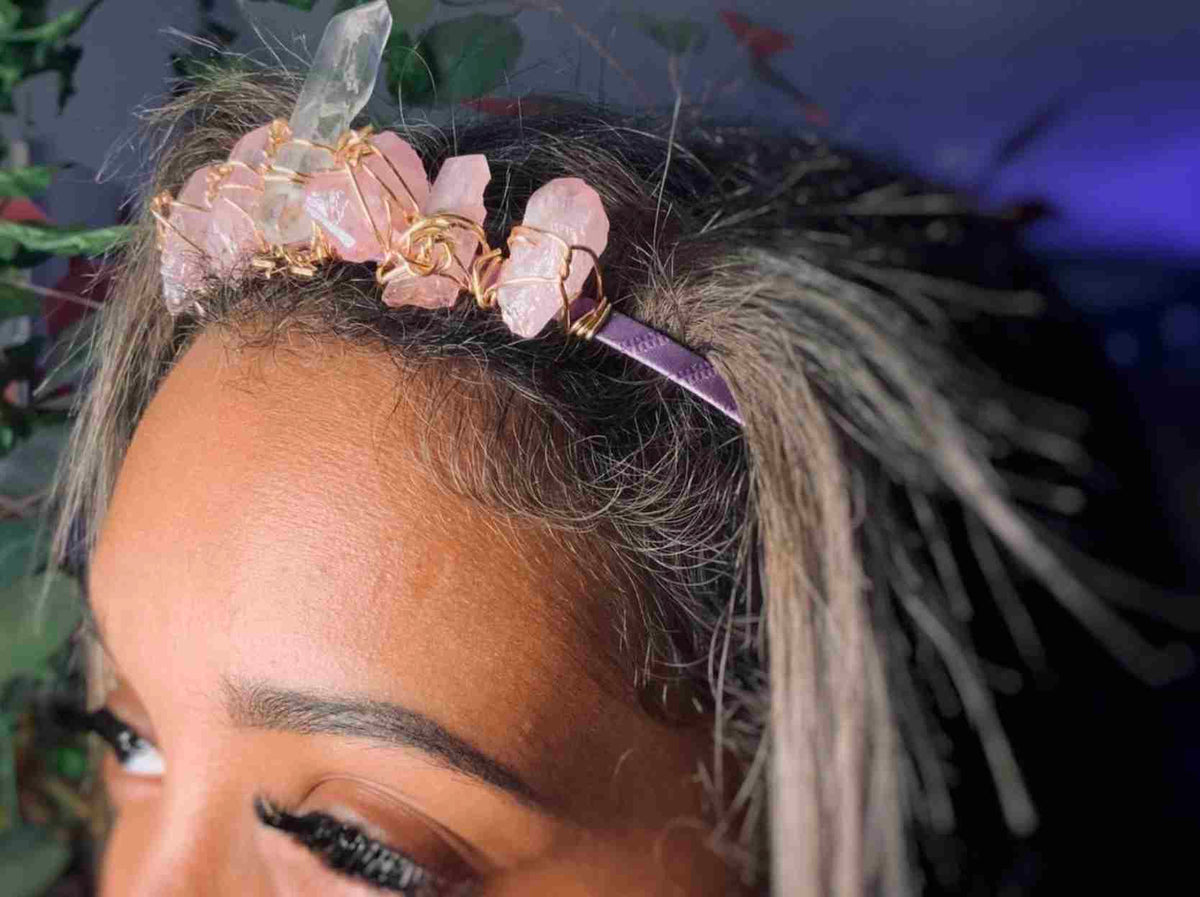 a close up of a woman with a flower in her hair.