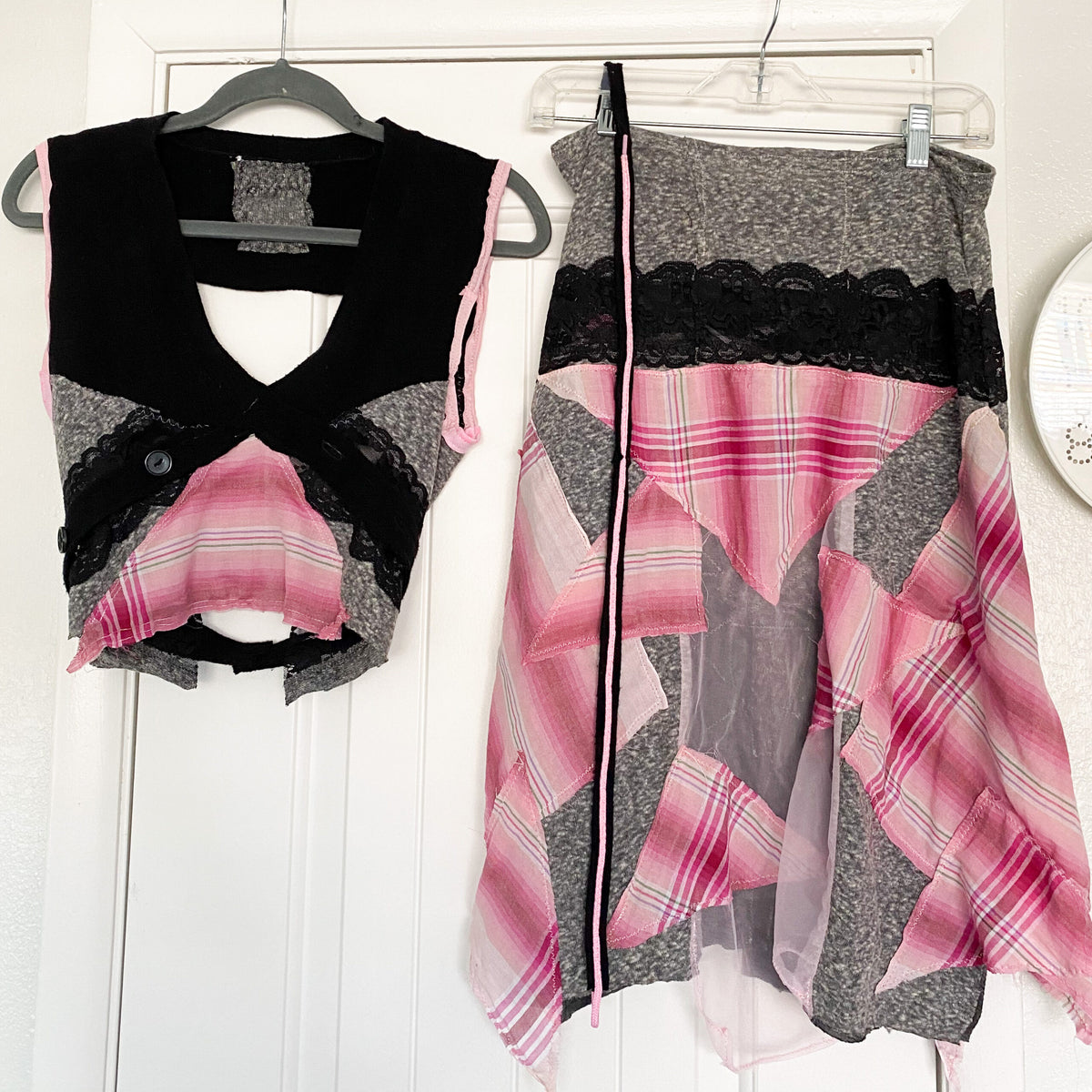 Two pieces of clothing hanging on a hanger.