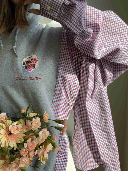 a woman is holding a bouquet of flowers.