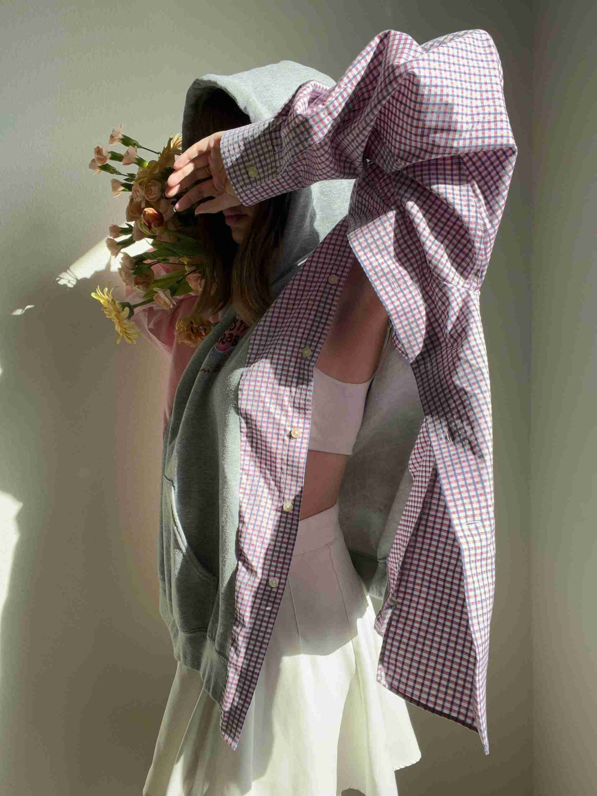 a woman is holding a bouquet of flowers.