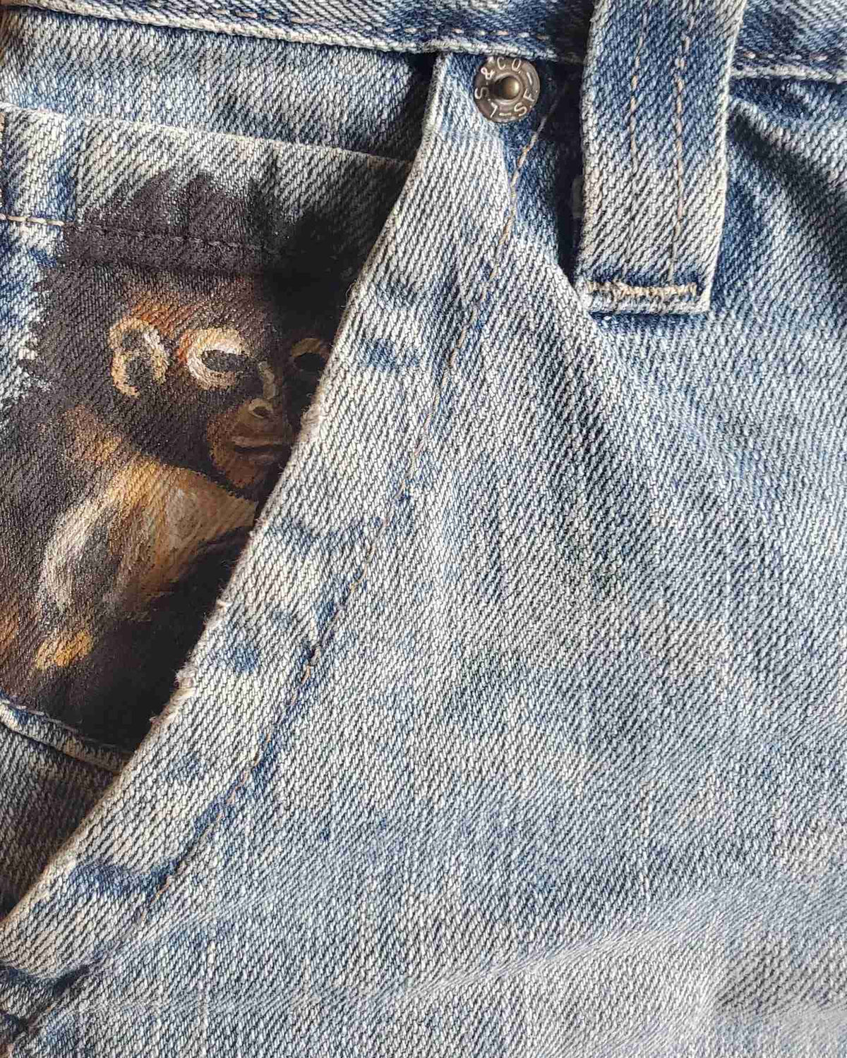 a pocket with a picture of a monkey on it.