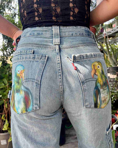 a person with a bird painted on their back pocket.