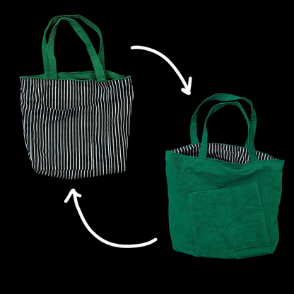 Two green and black striped tote bags on a black background.