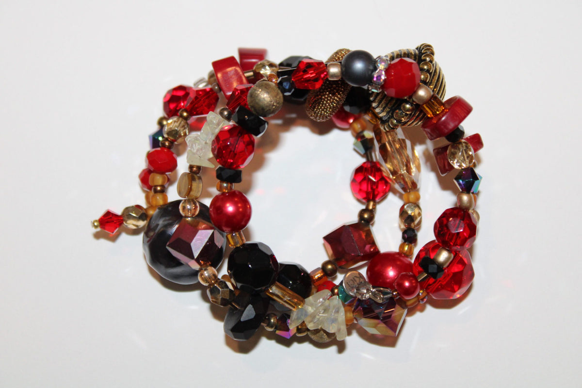 a close up of a large red bracelet .