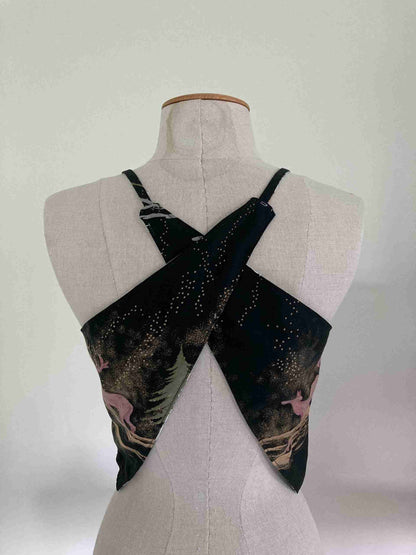 a white mannequin with a black and white scarf on top of it.