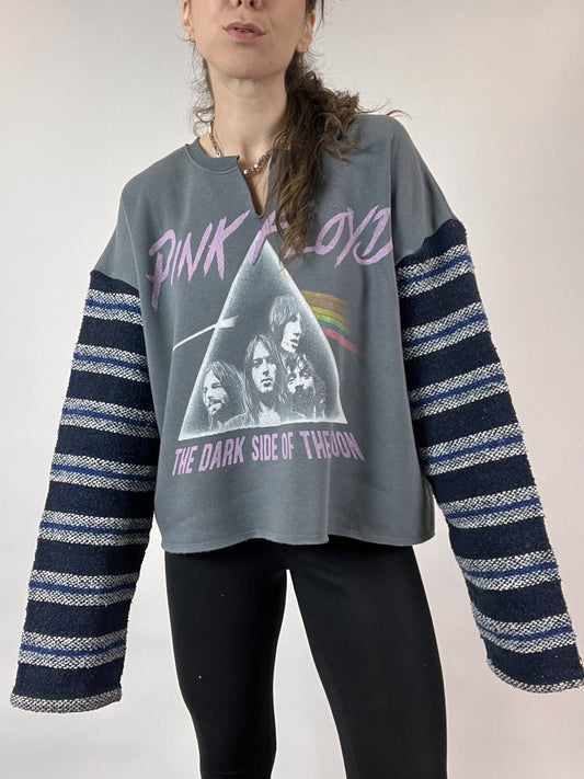 a woman with long hair wearing a pink floyd shirt.