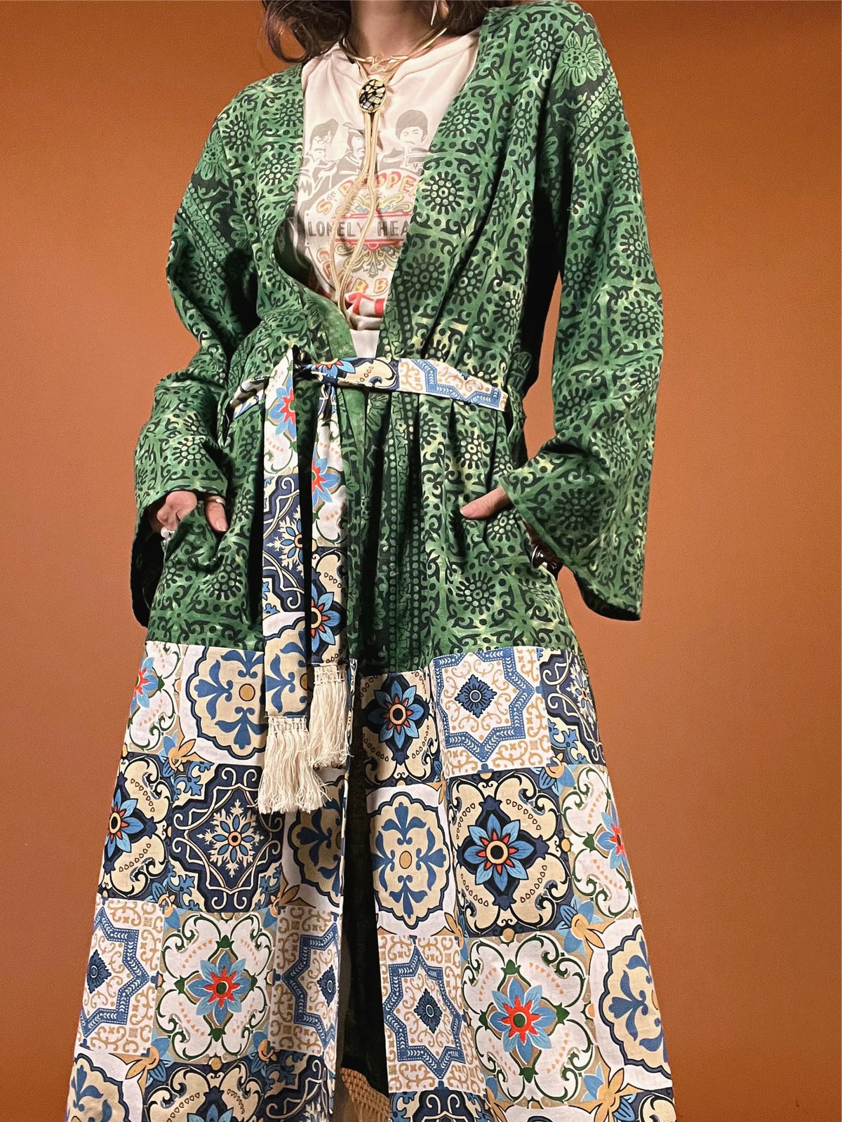 a woman wearing a green and blue dress.