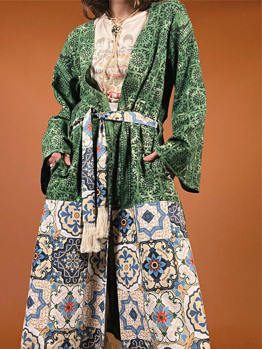 a woman wearing a green and blue dress.