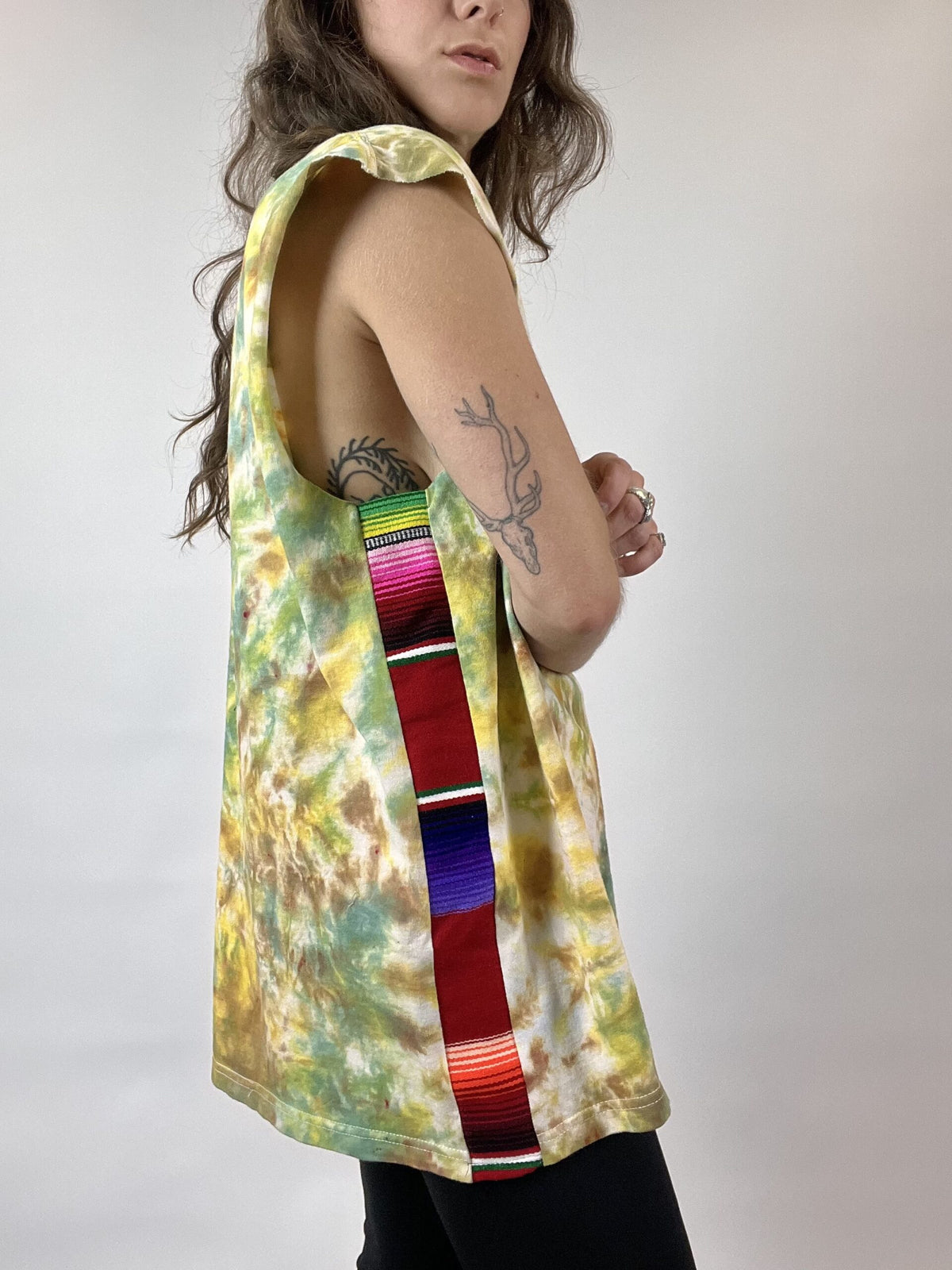 a woman with a tattoo on her arm.