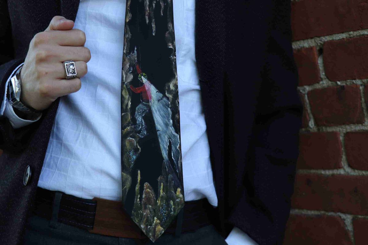 a close up of a person wearing a suit and tie.