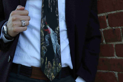 a close up of a person wearing a suit and tie.