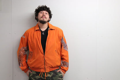 Orange jacket with hand-painted eels