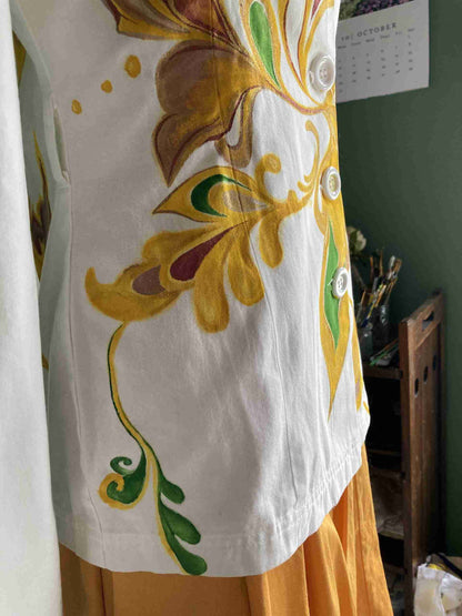 a white and yellow dress on a mannequin.