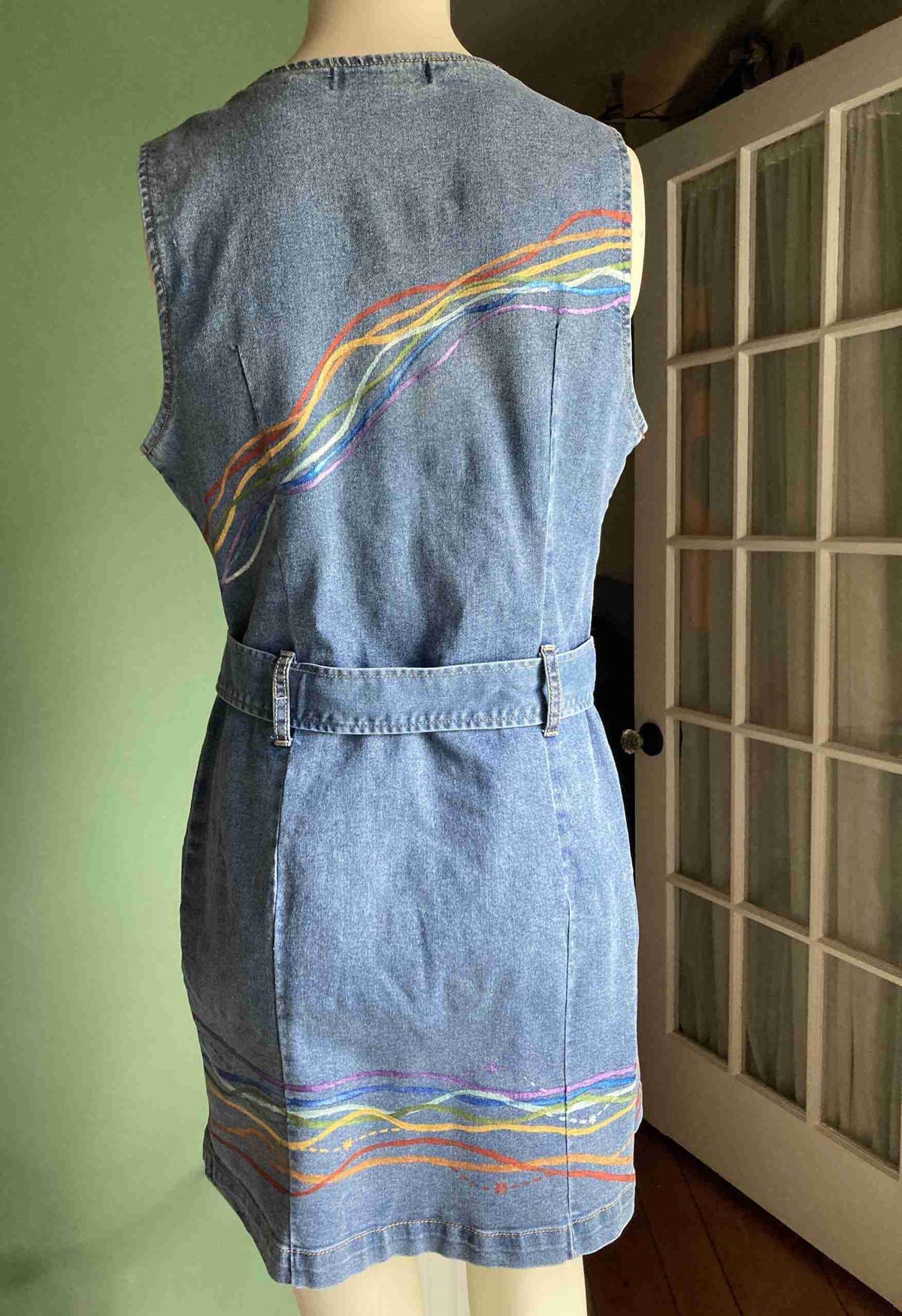 a dress made out of old jeans on a mannequin.