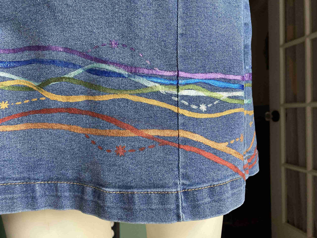 a close up of a person's skirt with a pattern on it.
