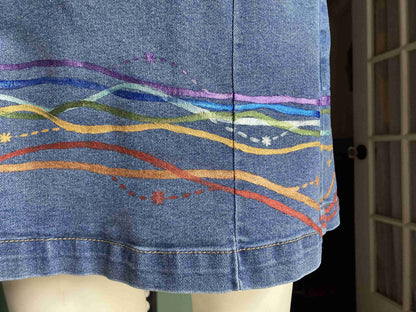 a close up of a person's skirt with a pattern on it.