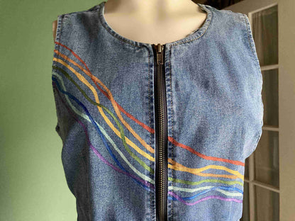 a denim dress with a zipper down the middle of it.