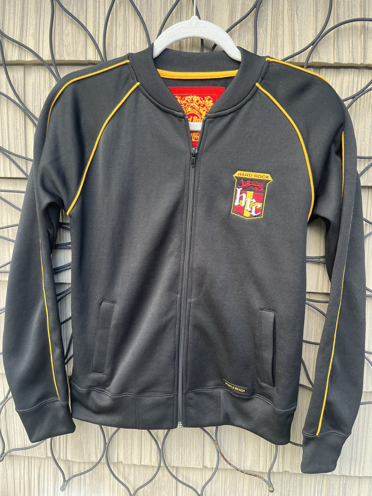 A harry potter jacket hanging on a wall.
